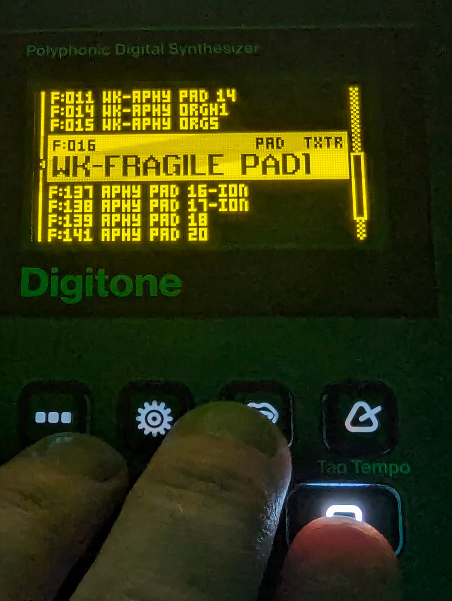 Fingers playing pad sound on Digitone synth