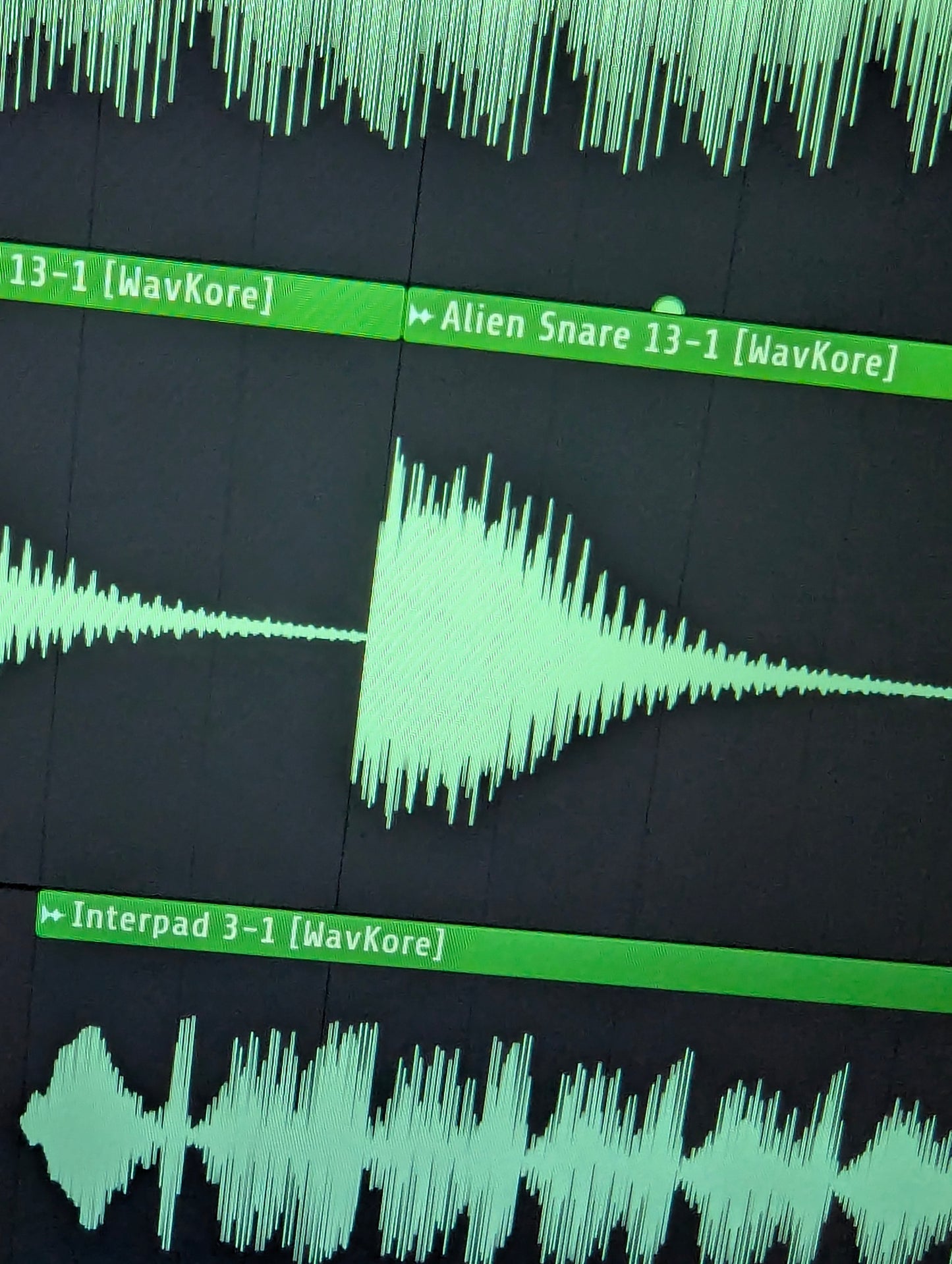 Close-up of pad and snare waveform sample in DAW