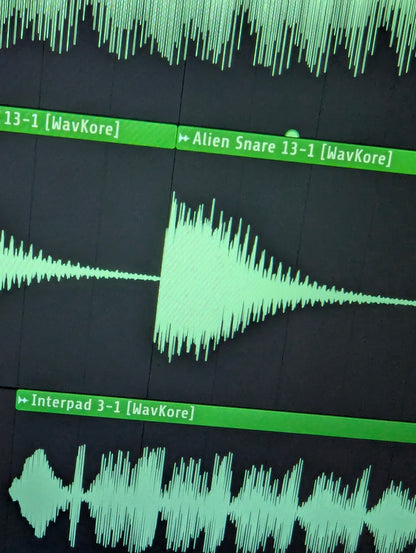 Close-up of pad and snare waveform sample in DAW